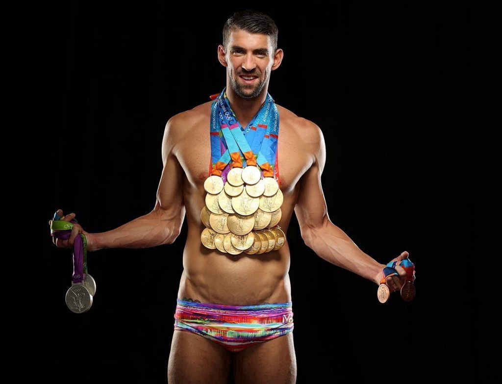 Michael Phelps showing off his 28 Olympic medals