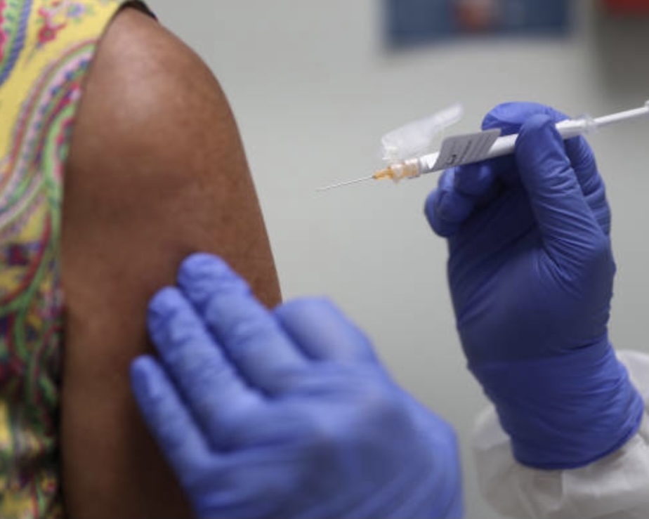 HOLLYWOOD, FL — A woman receives a COVID-19 vaccine in Aug. 2021. Photo Credit: Getty Images.